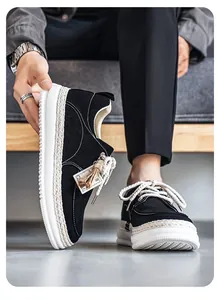Close-up of black men's sneakers featuring unique woven edges and thick white soles
