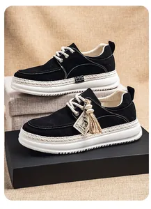 Side detail of black men's platform loafers with unique woven trim and IMPALA tag.
