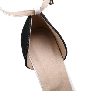 High-quality close-up of black denim pointed slingback pump showing insole texture