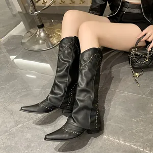 Vintage black pant-leg boots with gold rivets and western pointed toe, stylish women's wear