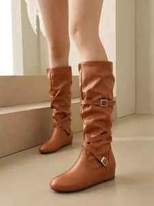 Stylish brown mid-calf slouchy boots with vintage pleated details and straps