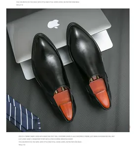 Hochwertige schwarze spitz zulaufende Herren-Leder-Loafer mit Laptop und Krawatte.