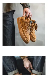 Close-up detail of brown suede men's Harajuku style casual sneakers with thick rubber soles.