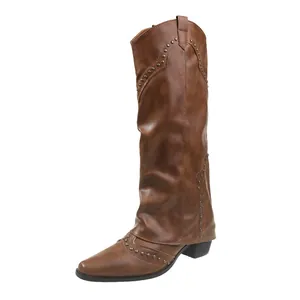Vintage brown knee-high cowboy boots with rivet detailing and slouchy design style