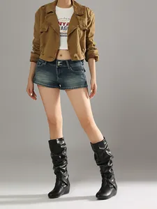 Detailed view of vintage slouch boots with pleated design and buckle straps