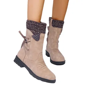 Vintage women's mid-calf Martin boots with knit cuff and back lace-up detail.