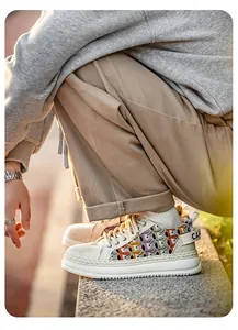Side view of men's thick-sole woven sneakers with colorful floral pattern details