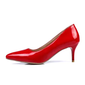Side view of elegant red patent leather pointed toe stiletto pumps with a 6cm heel.