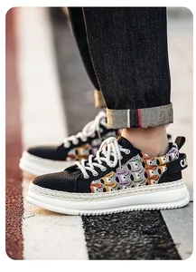 Detailed shot of men's platform sneakers with colorful woven mesh upper and rope laces.