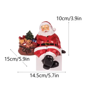 Festive Christmas Santa Claus resin figurine decoration with dimensions 14.5x10x15cm