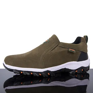 Detailed side profile of olive green men's outdoor casual shoe on reflective surface
