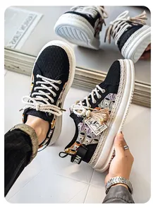 Detailed view of men's thick-soled casual shoes with woven edges and lace embroidery