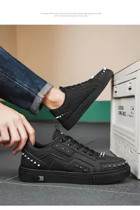 Side view showing silver rivet details and geometric stitching on black shoes