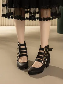 Vintage Roman style black Mary Jane boots with multi-buckle straps and block heel