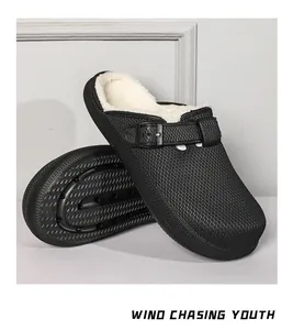 Detail view of men's black fleece-lined outdoor clogs with adjustable buckle strap