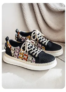 Detail of breathable woven men's sneakers with platform sole and colorful lace upper.
