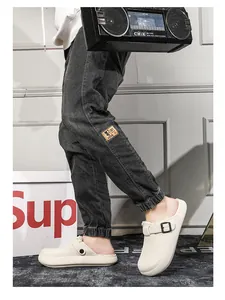 Detail view of men's warm fleece-lined outdoor clogs with thick soles and buckles.