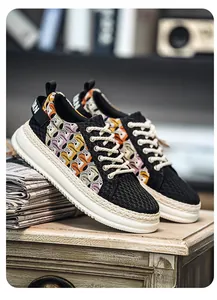 Close-up of men's fashion sneaker with breathable lace pattern and braided thick sole