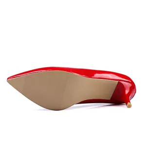 Sole view of red patent leather pointed-toe high heels with anti-slip texture.