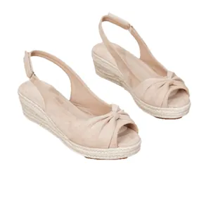 Elegant beige suede wedge espadrille sandals with knotted bow and slingback strap