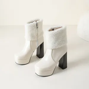 Cream chunky heel ankle boots with faux shearling cuff and platform sole in studio