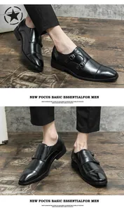 Detailed view of men's black leather double monk strap dress shoes on a wooden floor.