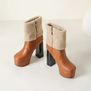 Stylish tan platform ankle boots with beige sherpa trim and high chunky black heels