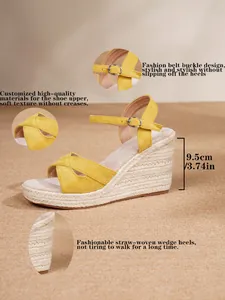 Detailed view of yellow straw-woven wedge sandals with 9.5cm heel height and buckle