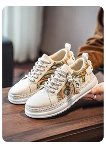 Detail view of men's woven athletic sneakers with thick soles and embroidered patterns