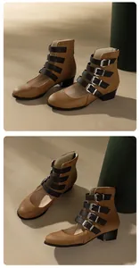 Detailed view of the four black buckle straps and retro textured leather on the boots
