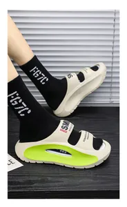 Detailed view of beige EVA sandals with thick neon green soles for summer comfort.