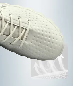 Close-up detail of off-white breathable athletic shoe with perforated mesh upper and laces