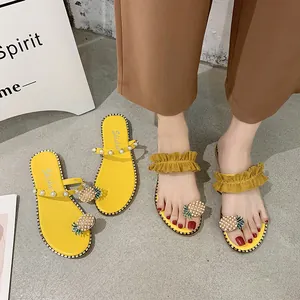 Stylish yellow flat sandals for women with pearl straps and cute pineapple toe detail