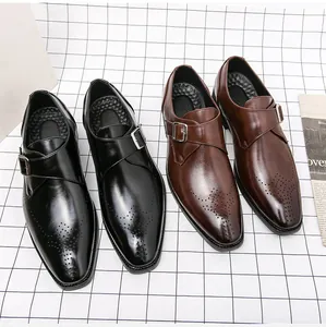 Black and brown monk strap business shoes with brogue detailing and square toe