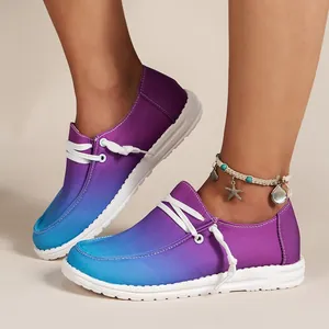 Close-up of summer purple to blue gradient loafers for women with white laces and sole