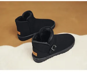 Close-up detail of black suede snow boots with side buckle and cozy warm fur lining