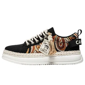 Men's thick sole woven sneaker with decorative tassel detail and white platform base