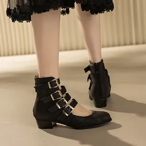Retro black chunky heel Mary Jane boots featuring multiple buckle straps and round toe