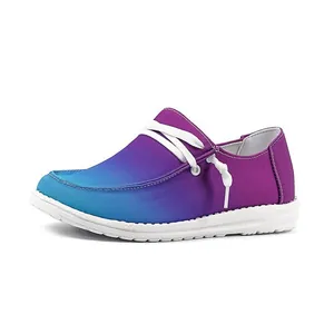 Close-up detail of women's purple and blue gradient flat loafers with white laces