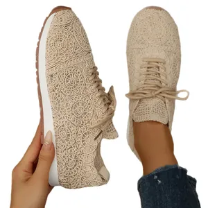 Elegant beige women's casual sneakers featuring intricate lace mesh and lace-up design