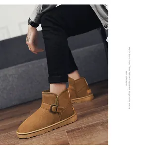 Close-up side view of brown suede snow boots with stylish buckle strap for winter warmth