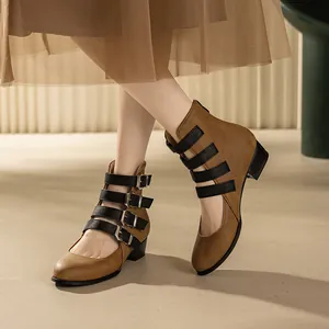 Vintage brown Mary Jane boots featuring chunky heels and multiple black buckle straps