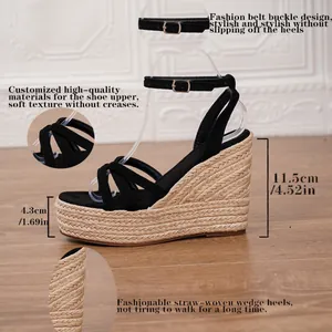 Fashionable black strappy wedge sandals with straw-woven espadrille platform and heel