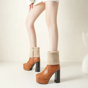 Detail view of brown chunky heel platform boots featuring a soft faux fur cuff
