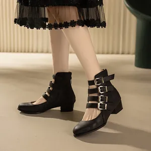 Elegant vintage black block heel Mary Jane boots featuring multi-buckle straps and cutout design