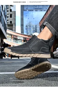 Detailed side and sole view of men's black leather outdoor slip-on Chelsea boots