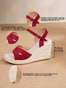 Detail view of red espadrille wedge sandals with 9.5cm heel height and ankle strap.