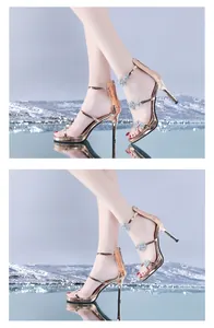 Detail of rose gold platform sandals featuring star and heart rhinestone decorations.