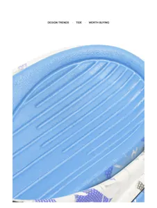 Macro close-up detail of the anti-slip ribbed footbed on blue sports beach sandals.
