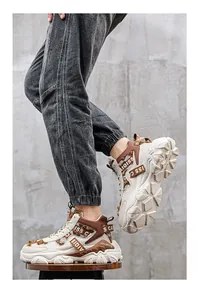 Side view detail of men's beige and brown chunky high-top platform basketball sneakers